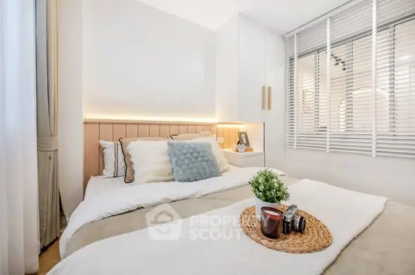 Cozy bedroom with modern decor and natural light