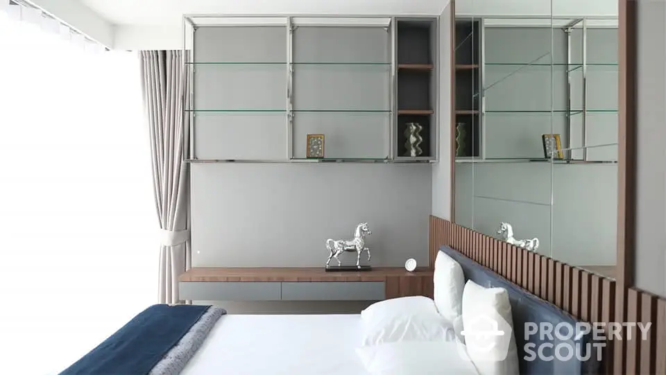 Modern bedroom with stylish decor and elegant shelving