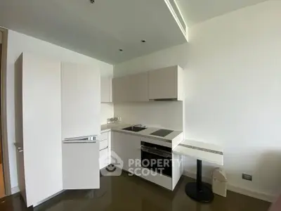 Modern kitchen with sleek cabinetry and built-in appliances in a minimalist design.