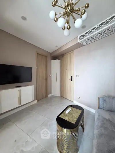 Modern living room with stylish chandelier and sleek furniture