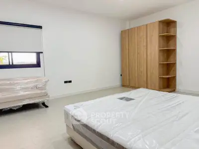 Spacious bedroom with new furniture and natural light