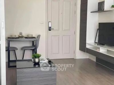 Modern living room with sleek furniture and dining area, perfect for urban living.