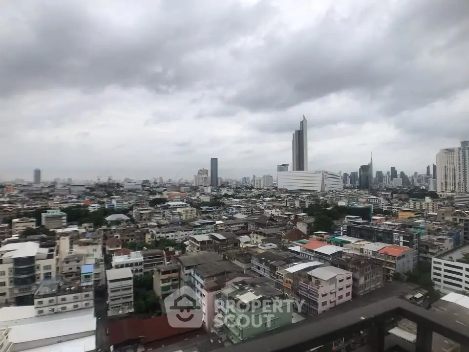 Stunning cityscape view from a high-rise balcony showcasing urban skyline and modern architecture.