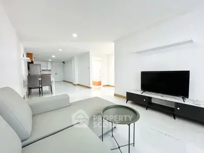 Spacious modern living room with sleek furniture and open layout