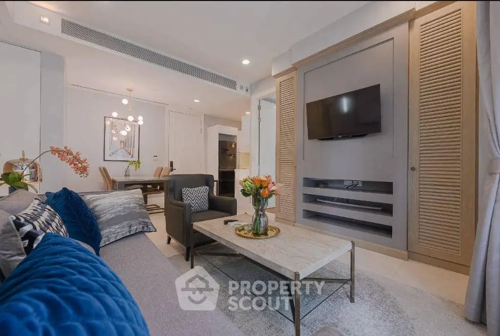 Luxurious modern living room with elegant decor and open dining area, perfect for stylish urban living.