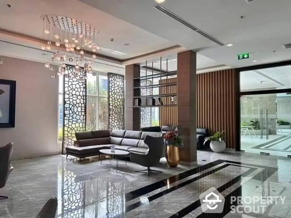 Luxurious modern lobby with elegant seating and stunning chandelier