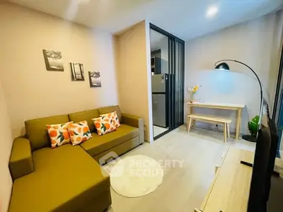 Cozy living room with modern decor and vibrant cushions in a stylish apartment.