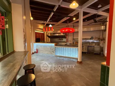 Charming open-layout kitchen with modern lighting and rustic decor, perfect for culinary enthusiasts.