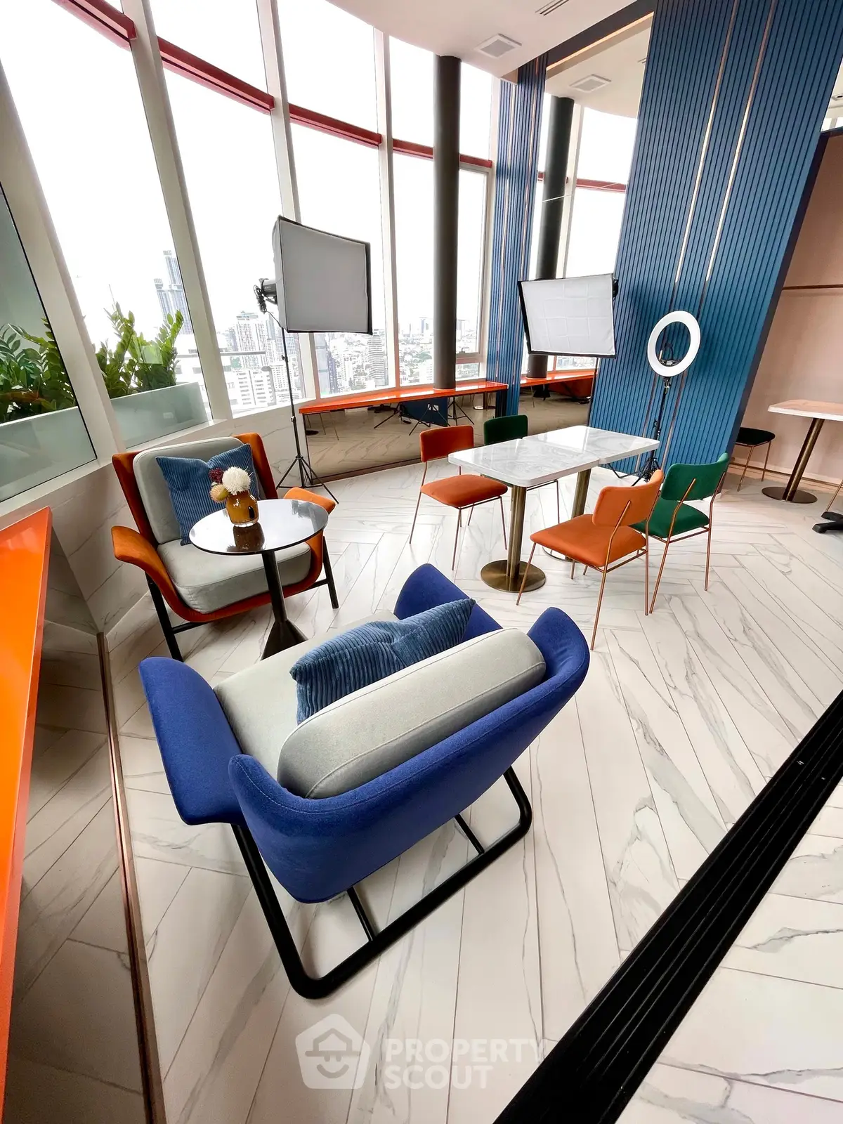 Modern interior with stylish seating and panoramic city views