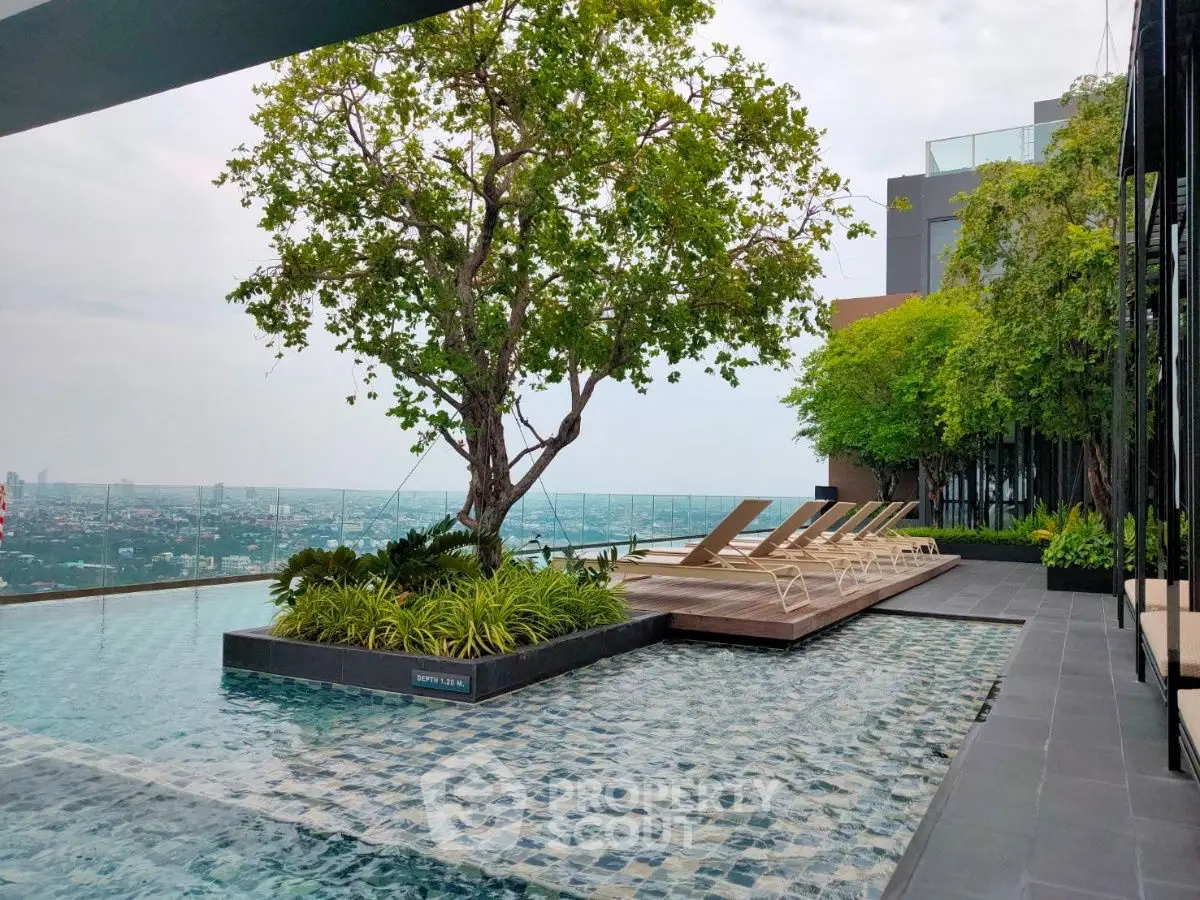 Luxurious rooftop pool with stunning city view and lush greenery