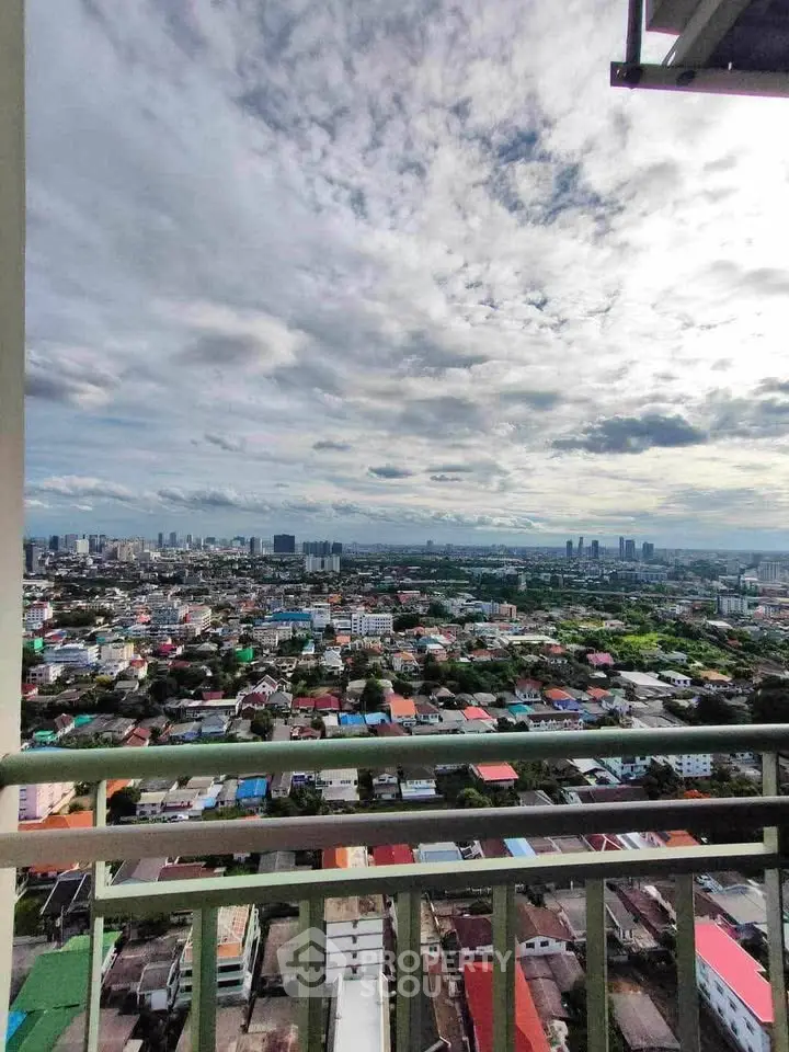 Stunning cityscape view from high-rise balcony with expansive skyline and vibrant urban landscape.
