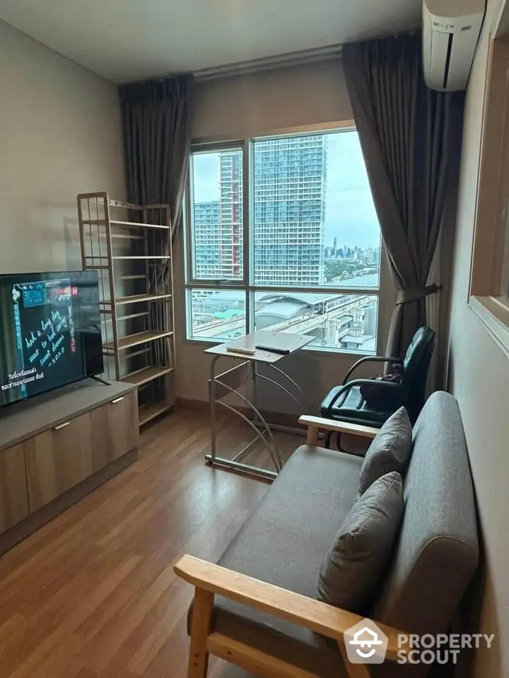 Cozy living room with city view, modern furniture, and large window for natural light.