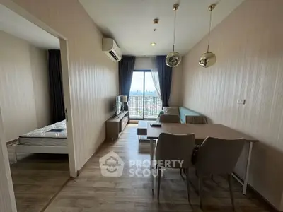 Modern apartment living room with dining area and city view balcony.