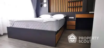 Elegant bedroom with a large comfortable bed, stylish headboard, and modern wooden furniture, perfect for restful nights.