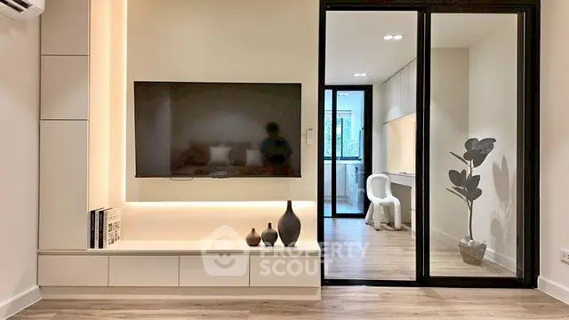 Modern living room with sleek TV setup and stylish decor