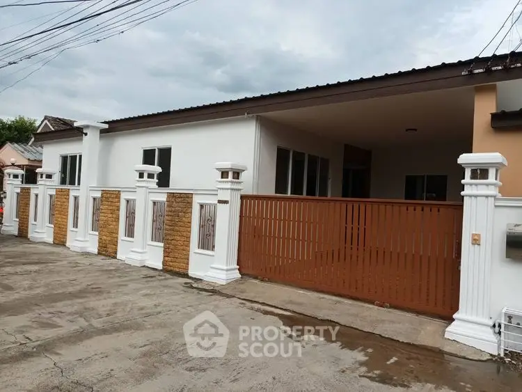 Charming single-story home with gated entrance and modern design.