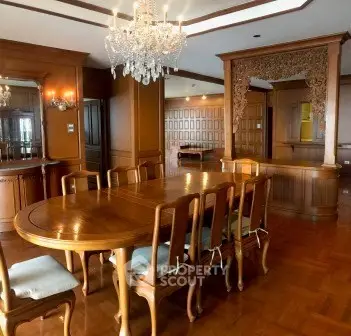 Luxurious dining room with elegant wooden furniture and chandelier