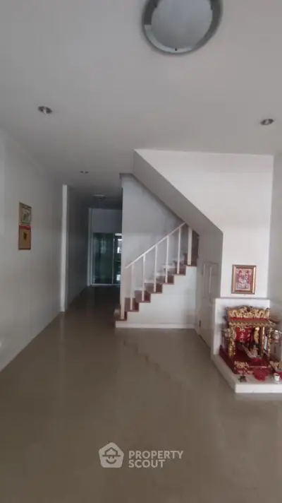 Spacious hallway with staircase in modern home interior
