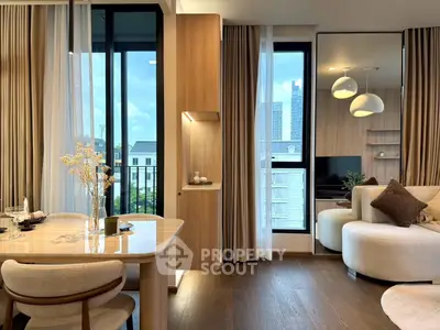 Modern living room with elegant decor and city view, featuring cozy seating and stylish lighting.