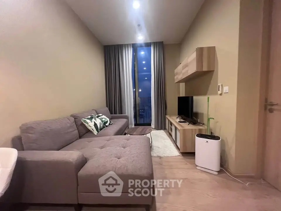 Modern living room with stylish furniture and cozy ambiance in a contemporary apartment.