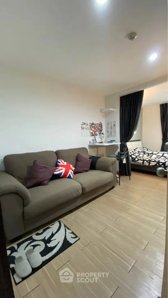 Cozy studio apartment with modern decor and comfortable furnishings, ideal for urban living.