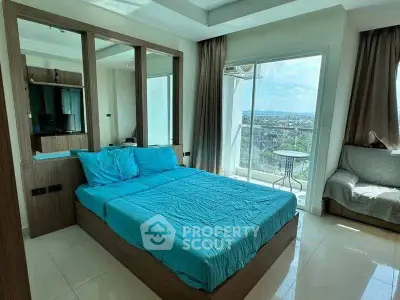 Modern bedroom with large windows and scenic view, featuring a cozy bed and stylish decor.