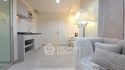 Modern living room with cozy decor and open kitchen layout