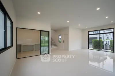 Spacious modern living room with large windows and sleek design