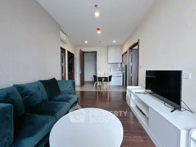 Modern living room with sleek furniture and open layout, perfect for urban living.