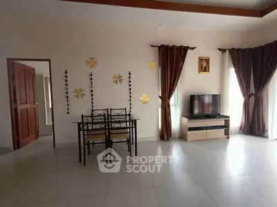 Spacious living room with modern decor and natural light