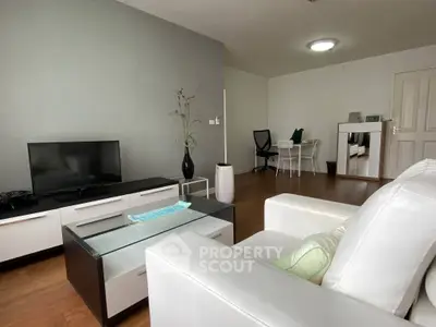 Modern living room with sleek furniture and stylish decor, perfect for comfortable living.