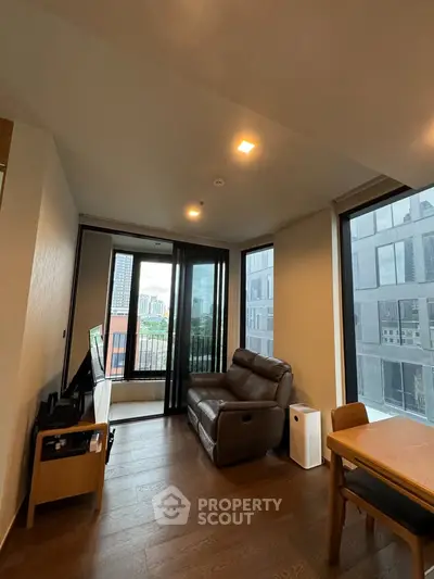 Modern living room with city view and cozy seating area