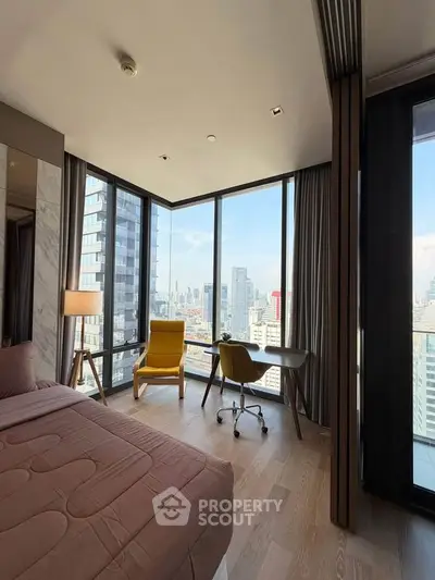 Luxurious corner bedroom with stunning city view and modern furnishings.