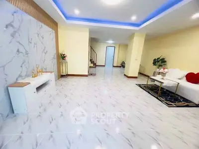 Spacious modern living room with elegant marble flooring and stylish decor