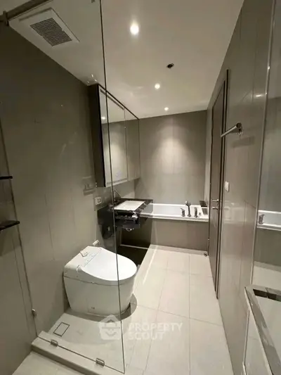 Modern bathroom with sleek design and bathtub in a contemporary apartment