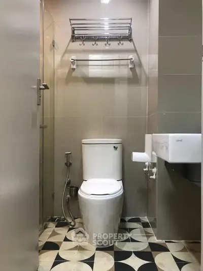 Modern bathroom with sleek fixtures and stylish tile flooring