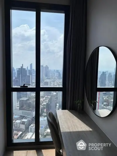 Stunning city view from modern high-rise apartment with sleek interior design