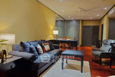 Spacious living room with elegant decor and cozy seating area
