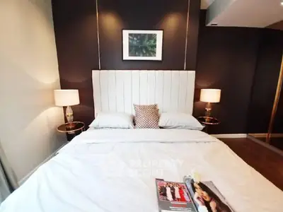 Luxurious bedroom with elegant decor and modern lighting