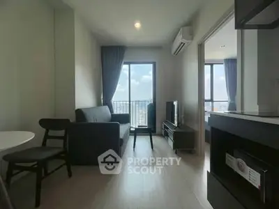 Modern living room with balcony view in high-rise apartment