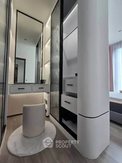 Modern walk-in closet with sleek design and ample storage space