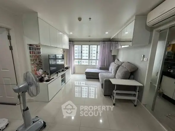 Modern living room with sleek furniture and natural light