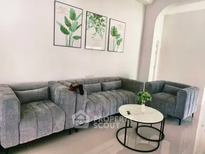 Modern living room with stylish gray sofas and chic decor
