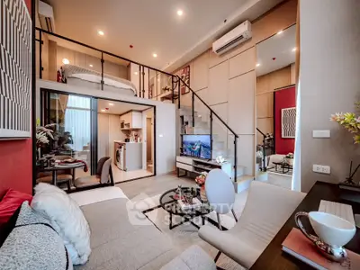 Modern loft apartment with mezzanine, stylish decor, and open living space.