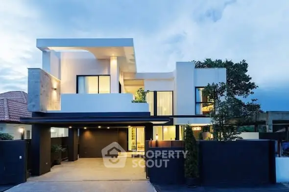 Modern luxury home exterior with sleek architecture and spacious driveway