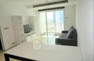 Modern living room with balcony view in high-rise apartment