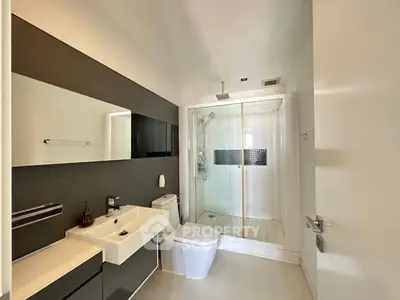 Modern bathroom with sleek design and glass shower enclosure