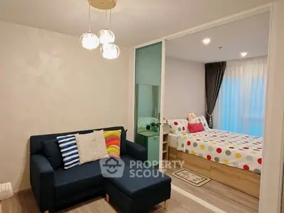 Chic modern living room with cozy sofa and stylish bedroom view, perfect for urban living.