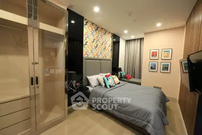 Modern bedroom with stylish decor and spacious layout in a luxury apartment.