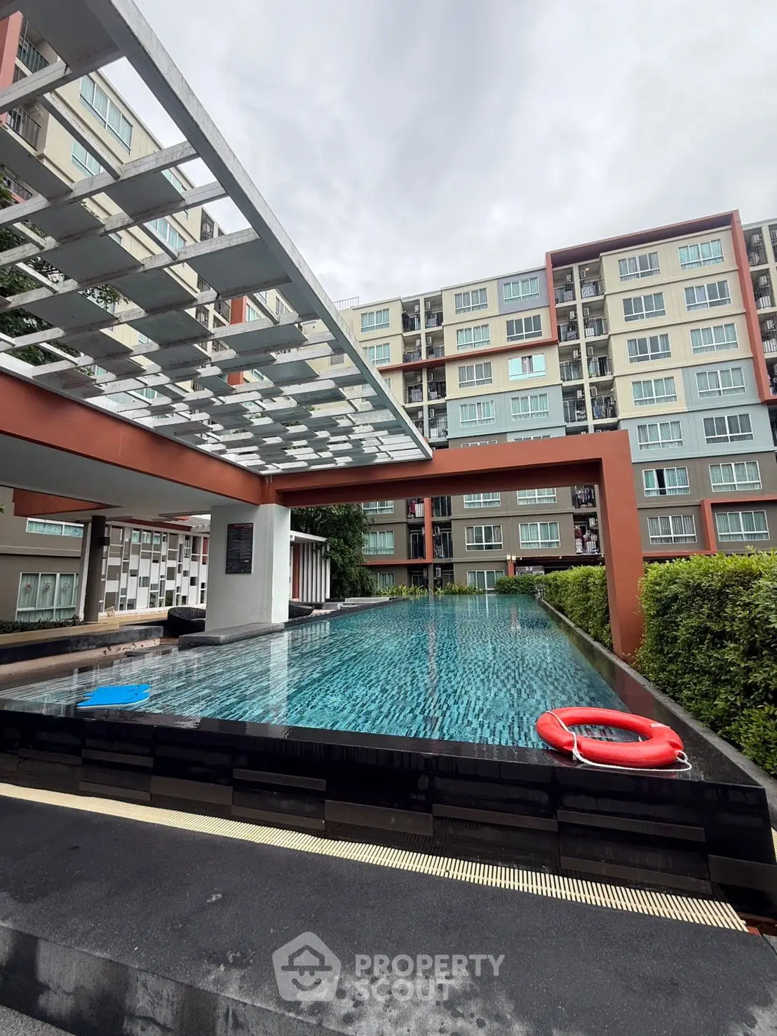 Modern apartment complex with a stylish pool and contemporary design.